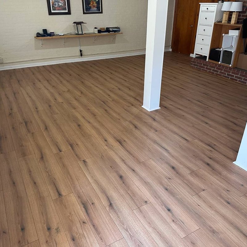 Durable laminate flooring replacing failed glue-down LVP with moisture issues