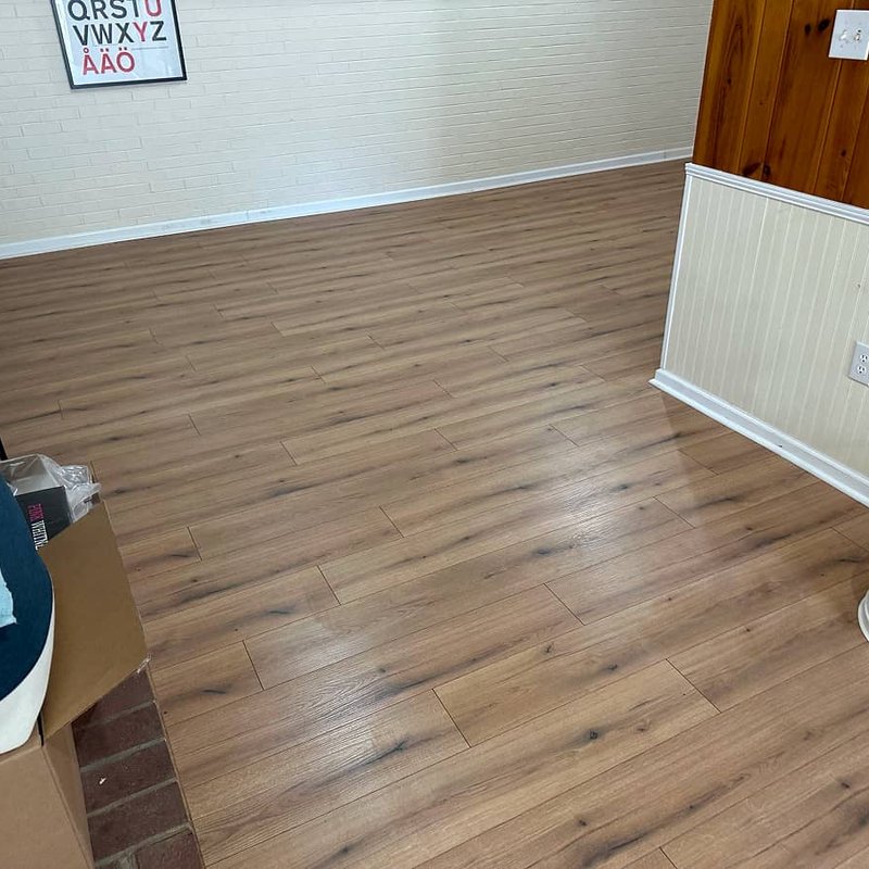 Accessible home interior with water-resistant laminate flooring for mobility needs